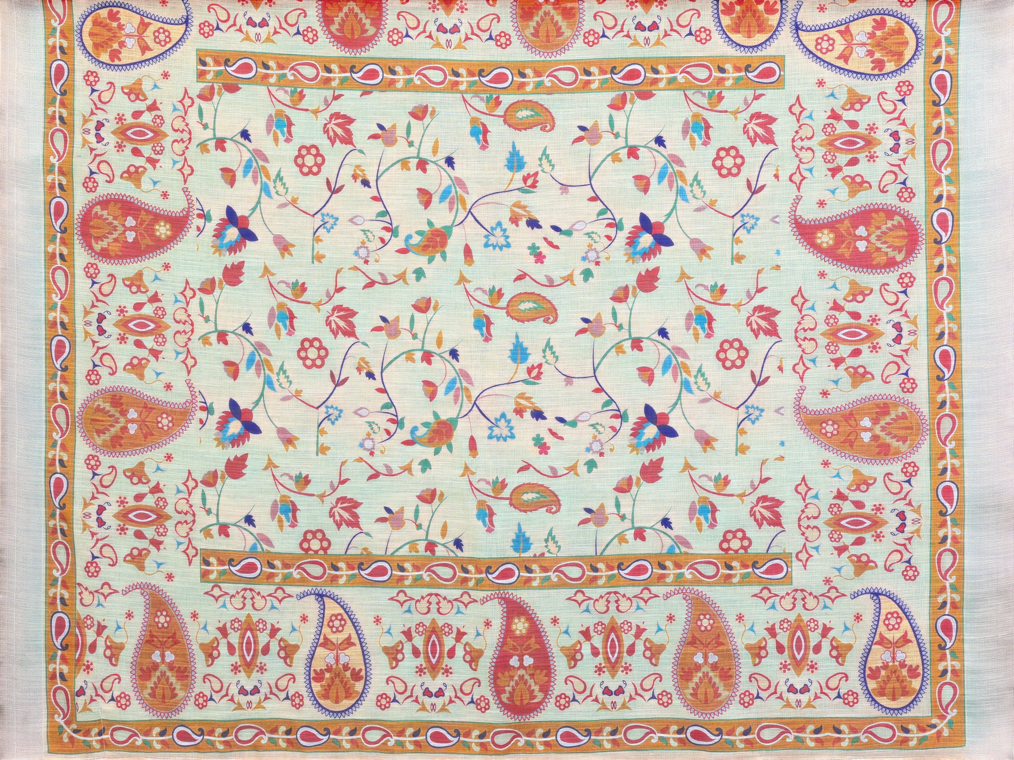 NxWear Fashion orange linen saree with intricate paisley and floral print. Features a running blouse piece.