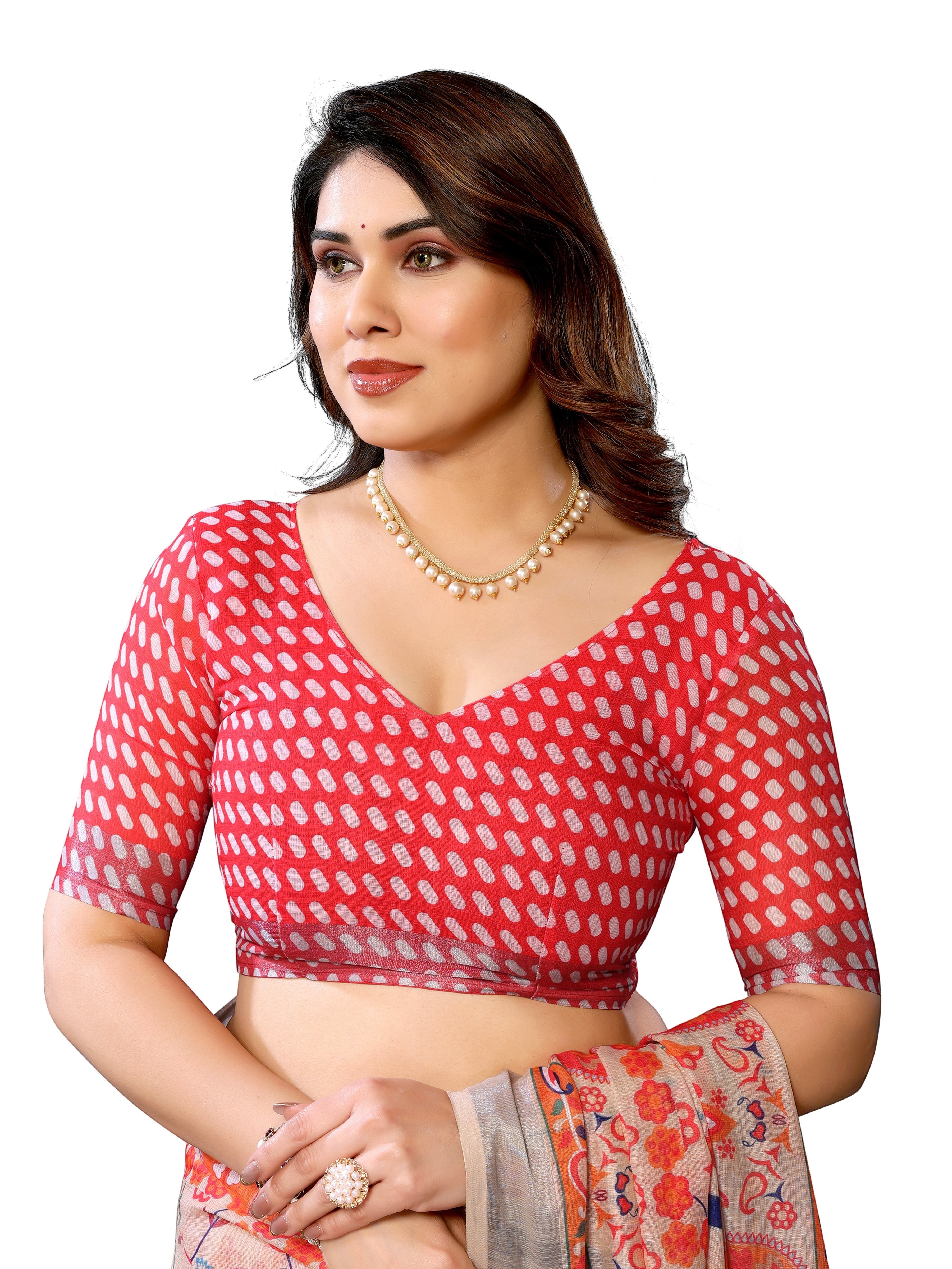 NxWear Fashion red linen saree with white polka dots and a printed pallu, worn by a model with pearl necklace.
