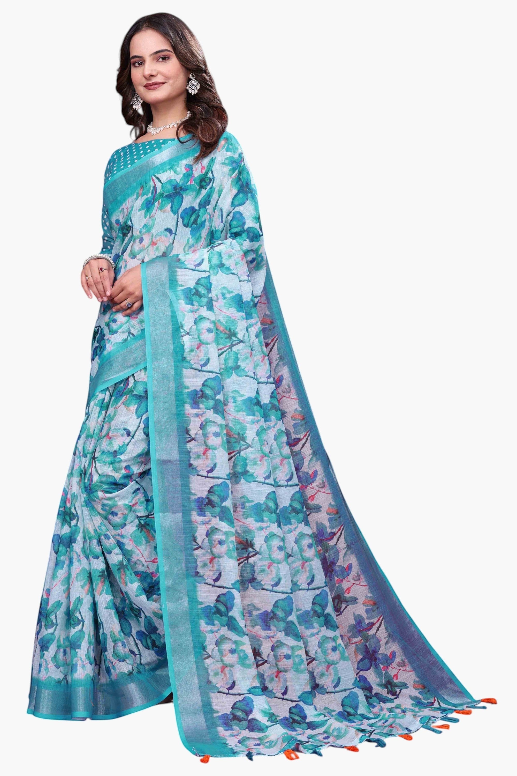NxWear Fashion teal linen saree with a delicate floral print and contrast border. Model wearing a pearl necklace and earrings.
